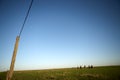 Cowboys riding into the green pastures at sunset Royalty Free Stock Photo