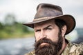 Cowboys in hat. Handsome bearded macho. Man unshaven cowboys. American cowboy. Leather Cowboy Hat. Portrait of young man Royalty Free Stock Photo