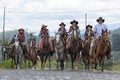 Cowboys riding on horse back