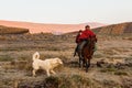 Cowboys riding horses,