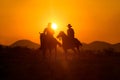 Cowboys are riding horses silhouette Royalty Free Stock Photo