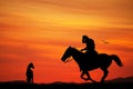 Cowboys silhouette at sunset Royalty Free Stock Photo