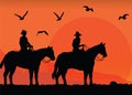 Cowboys silhouettes at sunset Royalty Free Stock Photo