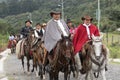 Cowboys in traditional wear riding in the Andes of Ecuador