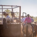 Cowboys On Horseback Watching Country Rodeo