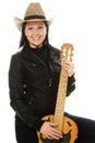 Cowgirl in ahat with acoustic guitar Royalty Free Stock Photo