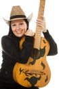 Cowgirl in ahat with acoustic guitar Royalty Free Stock Photo