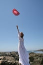 Cowgirl bride with hat in air Royalty Free Stock Photo