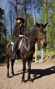 Cowgirl on brown horse Royalty Free Stock Photo