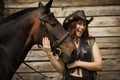 Cowgirl and brown horse Royalty Free Stock Photo