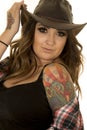 Cowgirl with colorful tattoos hold hat look close Royalty Free Stock Photo