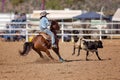 Cowgirl Competing In A Calf Roping Event At A Country Rodeo Royalty Free Stock Photo