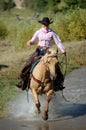 Cowgirl Crossing Pond Royalty Free Stock Photo