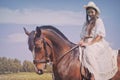 Cowgirl in white dress Royalty Free Stock Photo