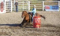 Cowgirls competing in barrel riding
