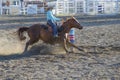 Cowgirls competing in barrel riding