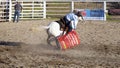 Cowgirls competing in barrel riding