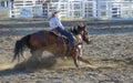 Cowgirls competing in barrel riding