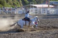 Cowgirls competing in barrel riding