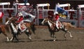 Cowgirls galloping on horseback