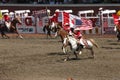 Cowgirls galloping on horseback