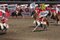 Cowgirls galloping on horseback