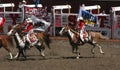 Cowgirls galloping on horseback