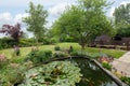 Landscaped back garden with water feature pond Royalty Free Stock Photo
