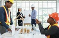 Coworker is talking while engineering project manager and businessman smiling and thumb up to successful business, selective focus Royalty Free Stock Photo