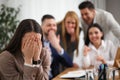 Coworkers bullying their colleague in office, space for text Royalty Free Stock Photo