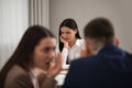 Coworkers bullying their colleague at workplace Royalty Free Stock Photo