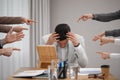 Coworkers bullying their colleague at workplace in office, closeup Royalty Free Stock Photo