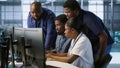 Coworkers in data center doing brainstorming, implementing AI