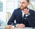 Coworkers discussing project in conference room. Royalty Free Stock Photo