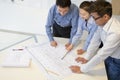 Coworkers discussing project in the office, looking down Royalty Free Stock Photo