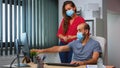 Coworkers with face masks working Royalty Free Stock Photo