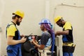 Coworkers refilling freon, fixing leaks Royalty Free Stock Photo