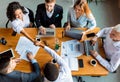 Coworkers Shaking Hands During Meeting Sitting In Modern Office, Top-View Royalty Free Stock Photo