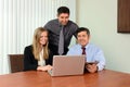 Coworkers Sharing Information on Laptop Royalty Free Stock Photo