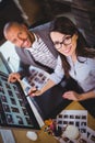 Coworkers smiling while pointing at computer Royalty Free Stock Photo