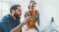 Coworkers team at work. Group of young business people in trendy casual wear working together in creative office Royalty Free Stock Photo