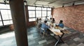 Coworkers working together in modern spacious loft