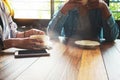 Coworkers young women of business teamwork working in cafe with smart phone. Royalty Free Stock Photo