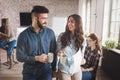 Coworking colleagues having conversation at workplace