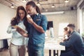 Coworking colleagues having conversation at workplace