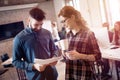 Coworking colleagues having conversation at workplace