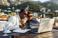 Coworking and freelance concept.Mixed race middle age black skin man and woman working together on laptop computer Royalty Free Stock Photo