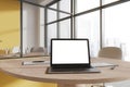 Coworking interior with laptop computer on table with mockup display, window Royalty Free Stock Photo