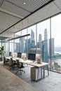 Coworking space with PCs and panoramic window view Royalty Free Stock Photo