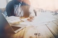 Coworking world and startup time. Adult businessman working at the wood table with new business project.Man touching Royalty Free Stock Photo